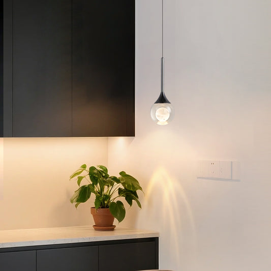 Modern creative water drop crystal pendant light featuring a lens light source at the bottom-1002